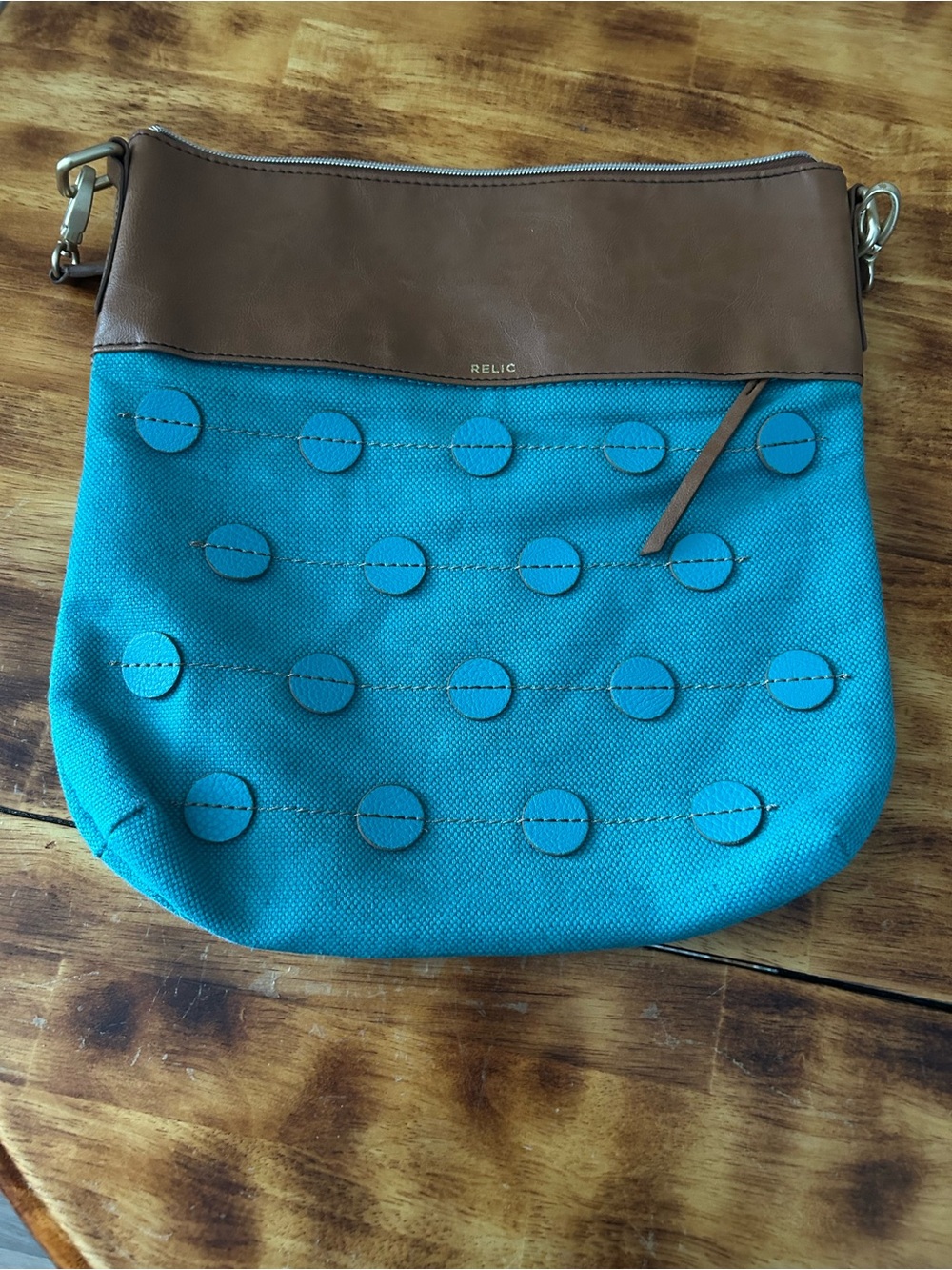 Relic Turquoise Canvas Crossbody with Brown Trim and Circle Accent